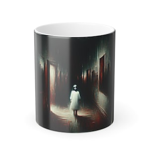 May include: A black and white ceramic coffee mug featuring a haunting image of a figure in a white gown walking down a dark hallway. The artwork has a distressed, painterly style, with red and brown accents.