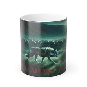 May include: A black and green ceramic coffee mug with a wolf walking through a field of sheep. The text "Wolf Among Sheep" is printed on the bottom of the mug.
