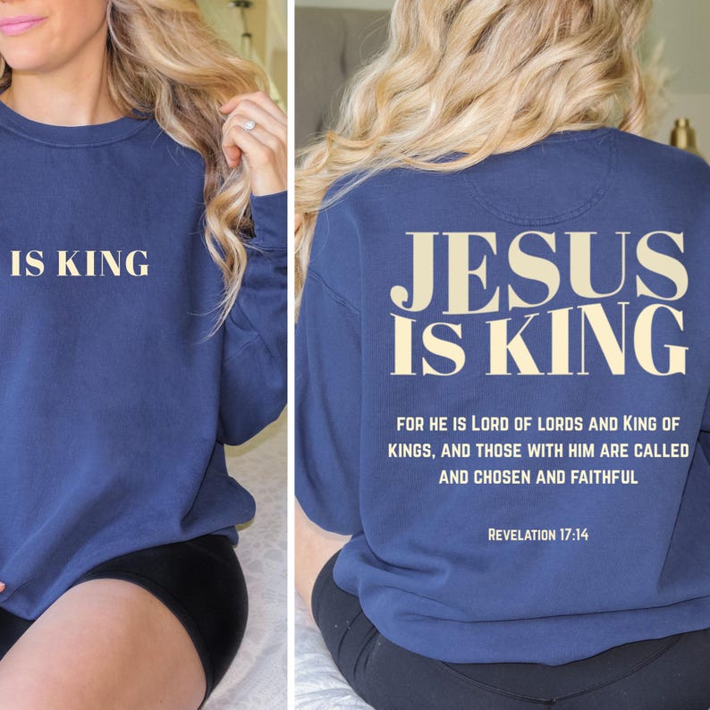 May include: Navy blue sweatshirt with the text "IS KING" on the front and "JESUS IS KING" on the back. The back of the sweatshirt also includes a Bible verse from Revelation 17:14.