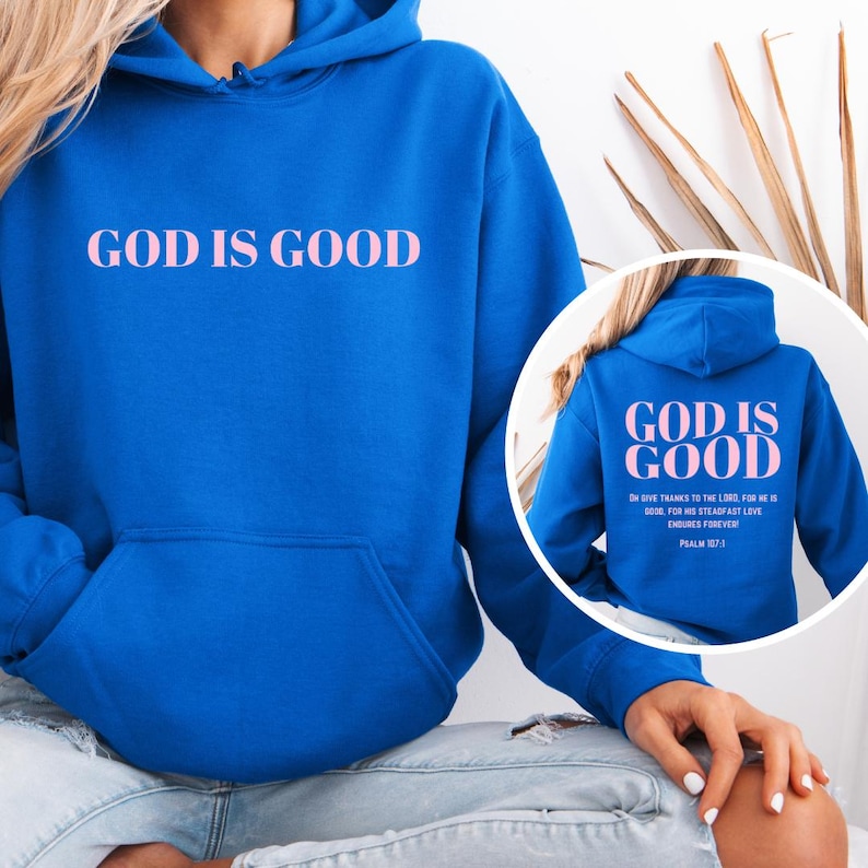May include: A royal blue hoodie with a pink "GOD IS GOOD" graphic on the front and a pink "GOD IS GOOD" graphic with a bible verse on the back.
