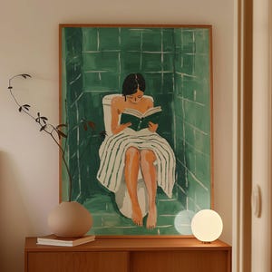 May include: A framed painting depicting a woman seated on a toilet, engrossed in a book, within a green tiled bathroom. The artwork is displayed on a wall in a bedroom featuring a wooden headboard and a bedside table with a lamp and a vase.