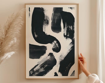 May include: Abstract art print with black brushstrokes on a white background. The print is framed in a light wood frame.