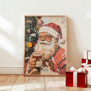 May include: A vintage-style illustration of Father Christmas holding a mug of hot chocolate in front of a snowy Christmas tree. The image is framed in a light wood frame.