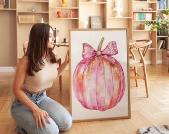 May include: A watercolor painting of a pink pumpkin with a sparkly pink bow. The pumpkin has a gold glitter texture and is set against a white background.