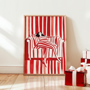 May include: A framed illustration of a person relaxing on a striped couch. The couch and the background are red and white stripes.