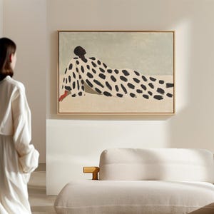May include: An abstract painting of a person lying down, wearing a patterned robe. The background is a light blue colour.