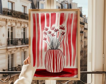 May include: A framed watercolor painting of a red and white striped vase with red flowers. The background is a red and white striped pattern.