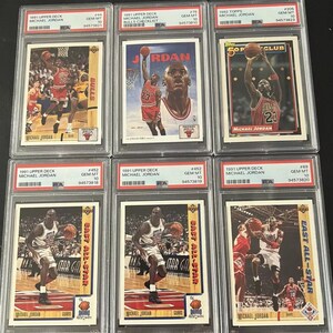 May include: A collection of ten Michael Jordan basketball trading cards from the 1991 Upper Deck, 1992 Topps, and 1991 Upper Deck East All-Star series. The cards feature images of Michael Jordan in his Chicago Bulls uniform and his East All-Star uniform. The cards are graded GEM MT 10.