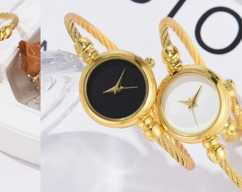 golden bangle style watch for women
