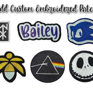 May include: Embroidered patches with various designs, including a geometric symbol, the name "Bailey", a blue hedgehog, a stylized flower, a prism with a rainbow, and a Jack Skellington face. The text "Add Custom Embroidered Patch" is at the top.