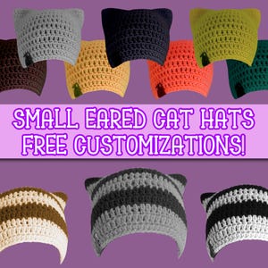 May include: A collection of ten crocheted cat hats with small ears. The hats are in various colors, including brown, orange, yellow, green, gray, and black. The hats are arranged in two rows, with the text "SMALL EARED CAT HATS FREE CUSTOMIZATIONS!" displayed in the center.