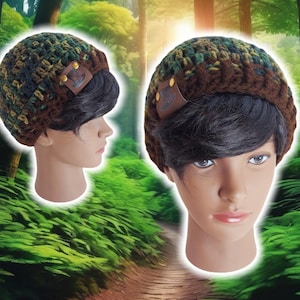 May include: A brown and green crocheted beanie with a brown leather patch. The beanie has a camouflage pattern.