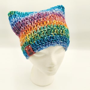 cute perky eared faded rainbow cat hat with a rag grungy look but well made from quality materials.