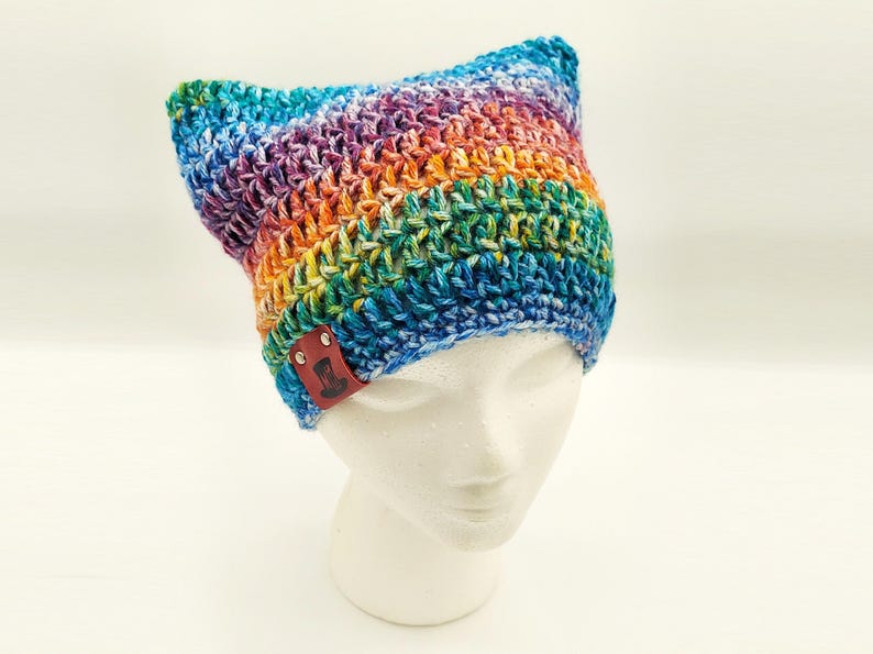 cute perky eared faded rainbow cat hat with a rag grungy look but well made from quality materials.