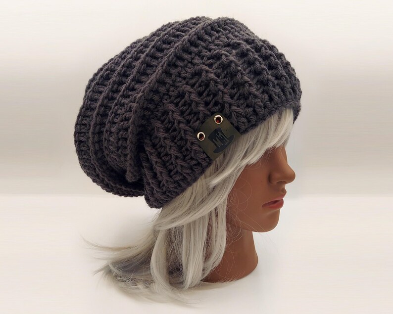 textured layers and large ribbed stretchy brim in this super slouchy hand crocheted beanie. ribbed toque - charcoal gray. These extra slouchy beanies have a baggy back but the stretchy ribbed brim stays securely on the head making it extremely comfortable and stylish.  This oversized beanie goes with many outfits and will draw eyes!  #modern beret beanie #baggy rastacap #oversized beanies #handmade crochet hat #baggy tams #big toques #customizable toboggans #textured chunky beanies