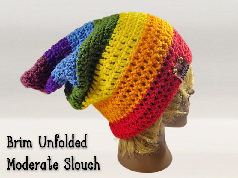 "brim unfolded - moderate slouch" - pointed beanie is shown from the side with its brim unfolded showing its long length and pixie shaped back part. Beanie can be adjusted to any height, slouch length, you can change the colors, the style, even change the brim type from foldable to ribbed.  make this beanie fit your style!  make general customizations free of charge!  Add pom poms, hand made embroidered patches, tassels, buttons, add your name, anything you want for your very own custom hat.