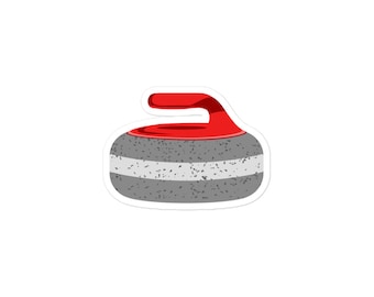 May include: A gray curling stone with a red handle. The stone has a white stripe around the middle.