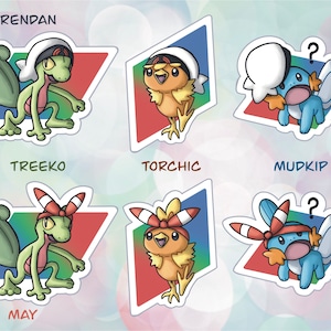 May include: Six colourful stickers featuring Pokemon characters from the Hoenn region. The stickers feature Treecko, Torchic, Mudkip, Brendan, and May. Each sticker has a name and a Pokemon character on a white background.
