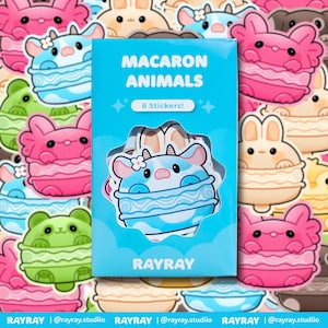 May include: A pack of six stickers with adorable animal designs shaped like macarons. The light blue package displays "MACARON ANIMALS" and "6 Stickers!". The stickers are in shades of pink, blue, green, and beige. The brand name "RAYRAY" is printed on the package.