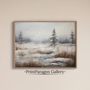 May include: A framed landscape painting depicting a snowy winter field with sparse evergreen trees under a cloudy sky. The scene features muted tones of white, grey, and brown, with a watermark reading PrintParagon Gallery centred.