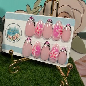 May include: A set of three ceramic mugs with a speckled, matte finish. The mugs are in shades of cream, light gray, and dark gray. Each mug has a simple, minimalist design, perfect for coffee or tea.