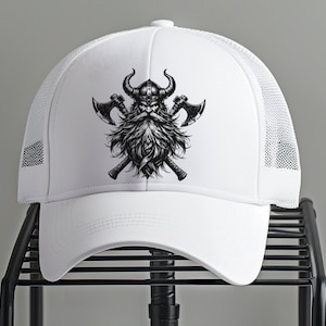 May include: White trucker hat with a black and white illustration of a Viking with a beard and axes.