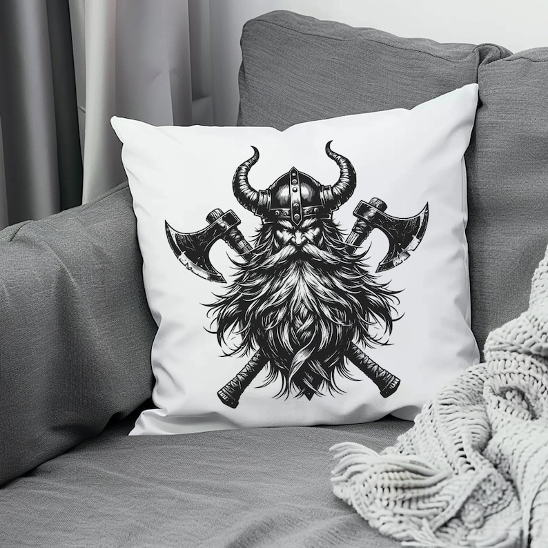May include: White throw pillow with a black and white illustration of a Viking warrior with crossed axes. The warrior is wearing a horned helmet and has a long beard.