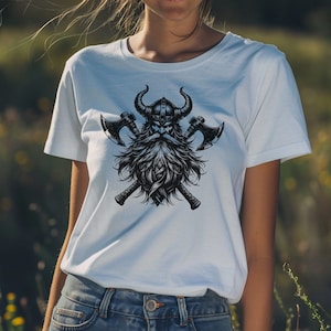 May include: White t-shirt with a black and white graphic print of a Viking warrior with a horned helmet and crossed axes.