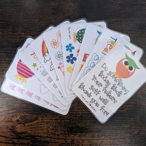 May include: A set of 10 colourful cards with inspirational messages and illustrations. The cards feature a rainbow, a heart, a cloud, a cupcake, a flower, a ladybug, a butterfly, a star, a sun, and an owl. The text on the cards includes the phrases "Do something today that your future self will thank you for!" and "Flowers are..."