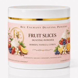 May include: A white jar with a gold band and a pink label featuring the text "FRUIT SLICES DUSTING POWDER." The label includes illustrations of berries, vanilla, and citrus fruits. The jar is labeled "BEE ENCHANT DUSTING POWDERS."