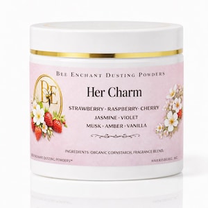 May include: A white jar of "Her Charm" dusting powder with a gold rim and lid. The label is pink with text and illustrations of strawberries and flowers. Ingredients include organic cornstarch and fragrance blend.
