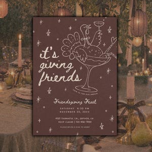 Dark mauve brown Friendsgiving invitation photographed against a rustic outdoor fall dinner party setting with autumn foliage, candlelight, and warm vintage-inspired details. The card features soft pink hand-drawn cocktail glass artwork, whimsical “it's giving friends” lettering, decorative bows, and small stars. This editable Canva Thanksgiving dinner invite has customizable text and colors, making it suitable for a friends fall feast, holiday potluck, or whimsical autumn gathering.