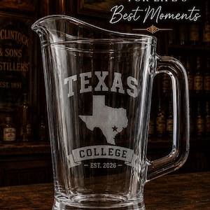 May include: A clear glass pitcher featuring an etched design with the word TEXAS above a map of the state, a star marking a location, and the text COLLEGE EST. 2026 on a banner. The top text reads Personalized FOR LIFE'S Best Moments.