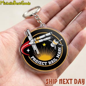 Portachiavi Project Hail Mary, toppa termoadesiva a tema missione spaziale e razzo fantascientifico.