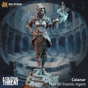 May include: A gray painted miniature figurine of a female elf warrior with a crown, holding a glowing blue sword. The figurine is standing on a stone base. The text "Calanar Half Elf Psionic Agent" is below the figurine.