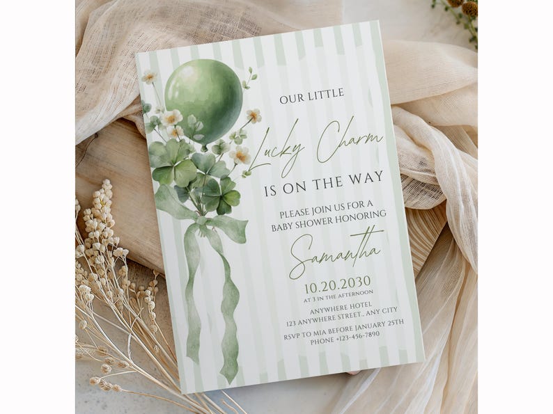 May include: Baby shower invitation with a green balloon, shamrocks, and floral accents. The invitation reads "Our Little Lucky Charm Is On The Way" and includes details for a baby shower honoring Samantha.