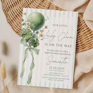 May include: Baby shower invitation with a green balloon, shamrocks, and the text "Our Little Lucky Charm Is On The Way." The invitation is decorated with a watercolor style and includes the name Samantha and event details.