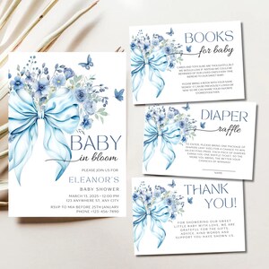 May include: Blue and white baby shower invitation with a watercolor illustration of a blue bow and flowers. The text reads "Baby in Bloom" and includes details for Eleanor's baby shower.