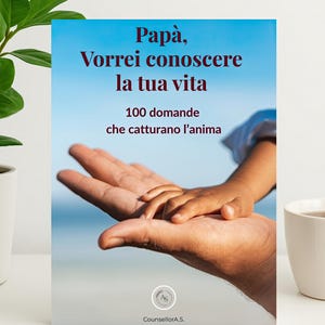 May include: A book titled "Papà, Vorrei conoscere la tua vita" with the text "100 domande che catturano l'anima" on a blue background. The cover features a photo of an adult's hand holding a child's hand. The book is by CounsellorA.S.