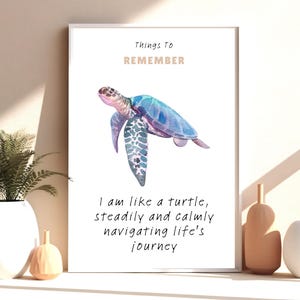 May include: A framed print with a watercolor illustration of a sea turtle in shades of blue, purple, and pink. The text at the top reads "Things To Remember," and below the turtle, it says, "I am like a turtle, steadily and calmly navigating life's journey."