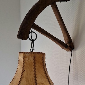 Unique hanging wall lamp, antique wood, wagon wheel and heavy iron work, vintage seventies shade, quality! Handmade! Amazing!!