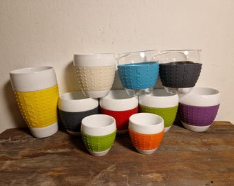 Bodum Pavina coffee and espresso mugs, porcelain with silocone band, grey, red, orange, green in very good condition. Koziol mugs blue.