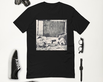 May include: Black t-shirt with a square graphic of a black and white street scene. The image includes a camera, black sneakers, a watch, and glasses. The t-shirt is the central focus of the image.