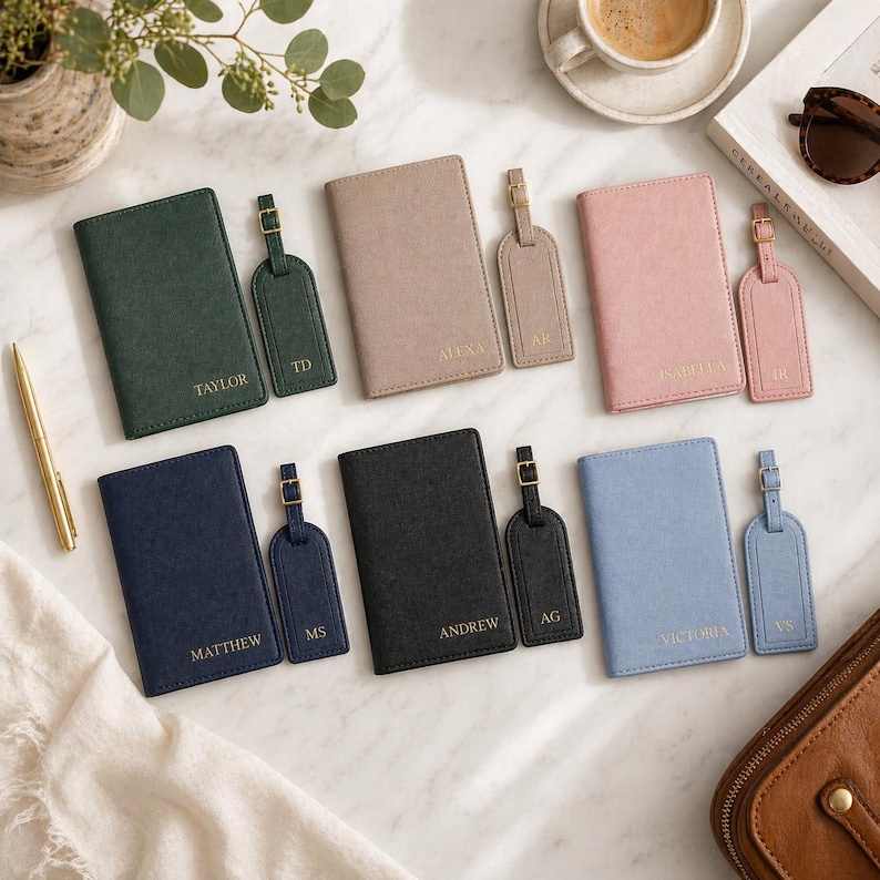 May include: Six sets of rectangular passport holders and matching luggage tags in dark green, beige, pink, navy blue, black, and light blue. Each item features gold-toned hardware and personalized names or initials embossed in gold lettering.