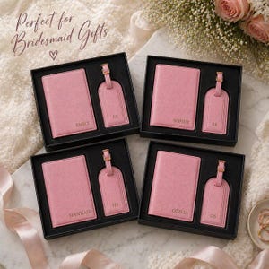 May include: Four black gift boxes each containing a pink passport holder and a matching pink luggage tag. The items are personalized with names including Emily, Sophie, Hannah, and Olivia, and initials ES, SR, HS, and OS in gold lettering.
