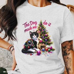 The Dog Made Me Do It - Playful Cat with Christmas Tree and Lights png clipart - Perfect for T-shirt Design and Holiday Decor DTF transfer