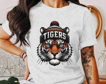 Playful Cartoon Tiger Face with Beanie Hat - Png Sport Logo Clipart Perfect for T-shirt Design, Sublimation, and School Team Mascot - TIGERS