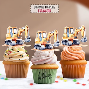 May include: Three cupcakes topped with excavator-shaped decorations. The cupcakes have different frosting colors: white with sprinkles, pink, and orange. The cupcake liners are brown and green. The image includes the text "CUPCAKE TOPPERS EXCAVATOR".