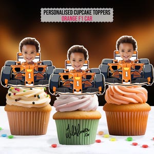 May include: Three cupcakes topped with personalized orange F1 car toppers featuring a child's face. The cupcakes have different frosting colors and sprinkles. The text "PERSONALISED CUPCAKE TOPPERS ORANGE F1 CAR" is at the top.