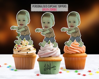 May include: Three cupcakes with personalized zombie-themed toppers. Each topper features a cartoon zombie illustration with a child's face. The cupcakes have different frosting colors and are decorated with sprinkles. The text "PERSONALISED CUPCAKE TOPPERS GREEN ZOMBIE" is at the top.